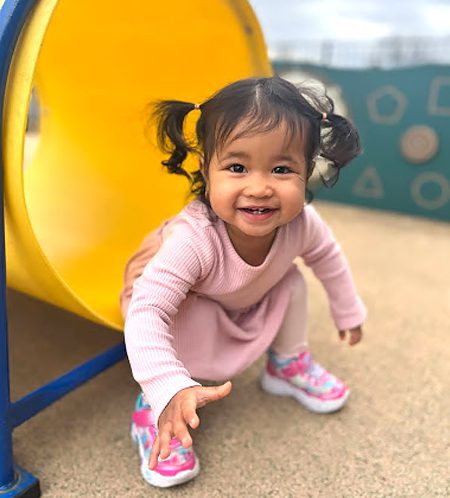 Creative-Kids-Family-toddler-girl-on-playground